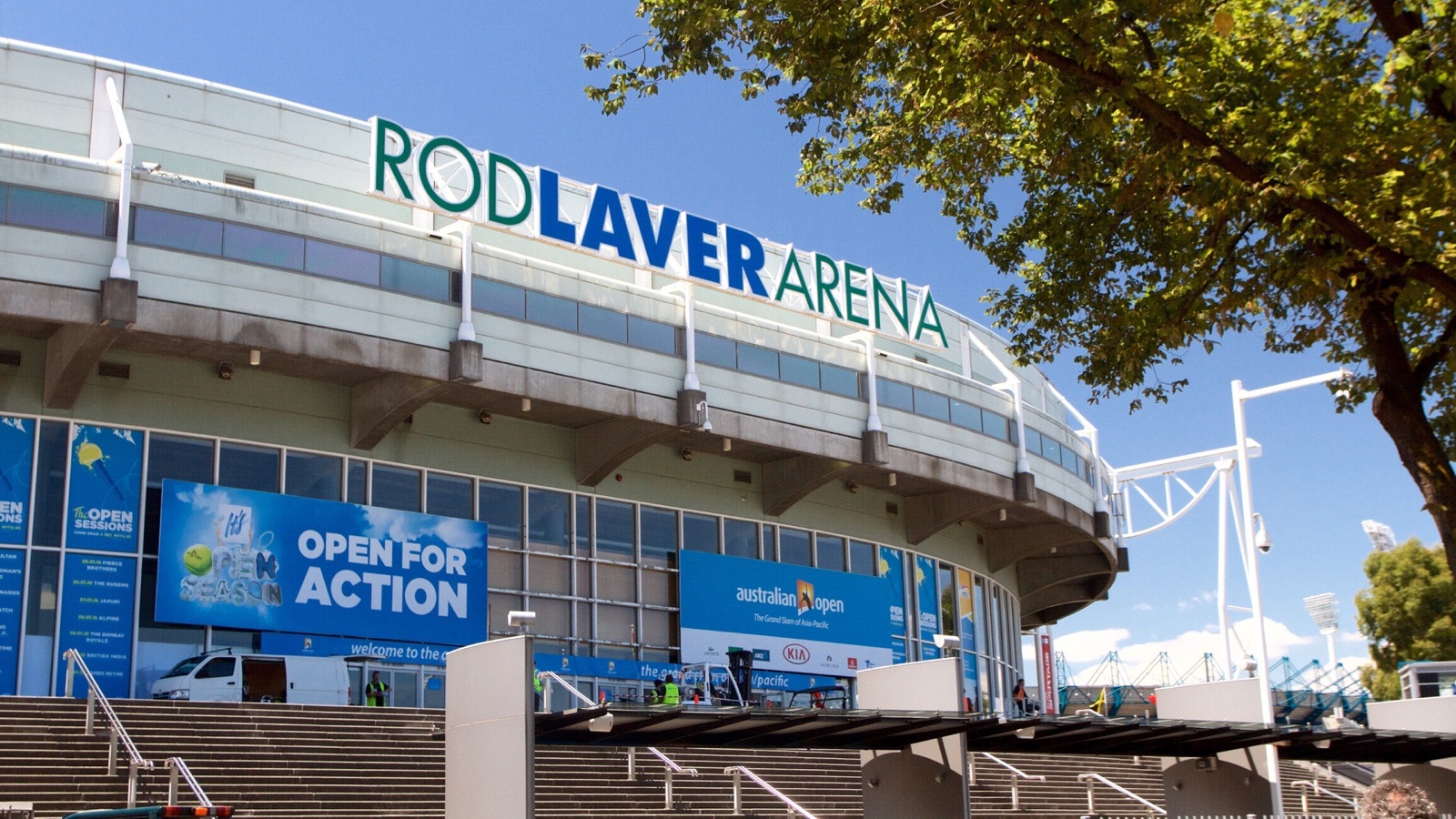 Rod Laver Arena exterior with 'Open for Action' campaign signage